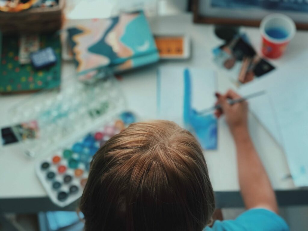 woman painting with water colors