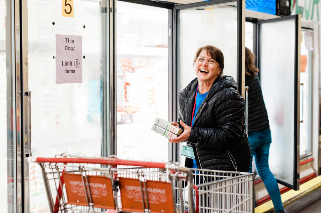 woman at freezer in shop