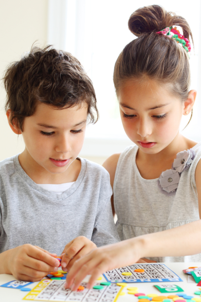 two kids playing bingo