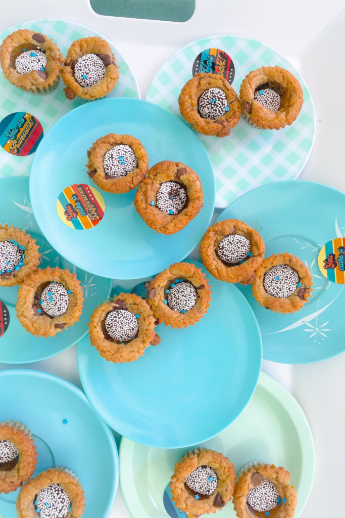 blondies on blue plates with chocolate sprinkle candies in each