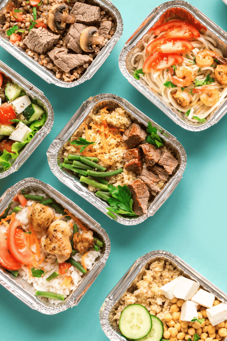 prepared meals in containers with blue background
