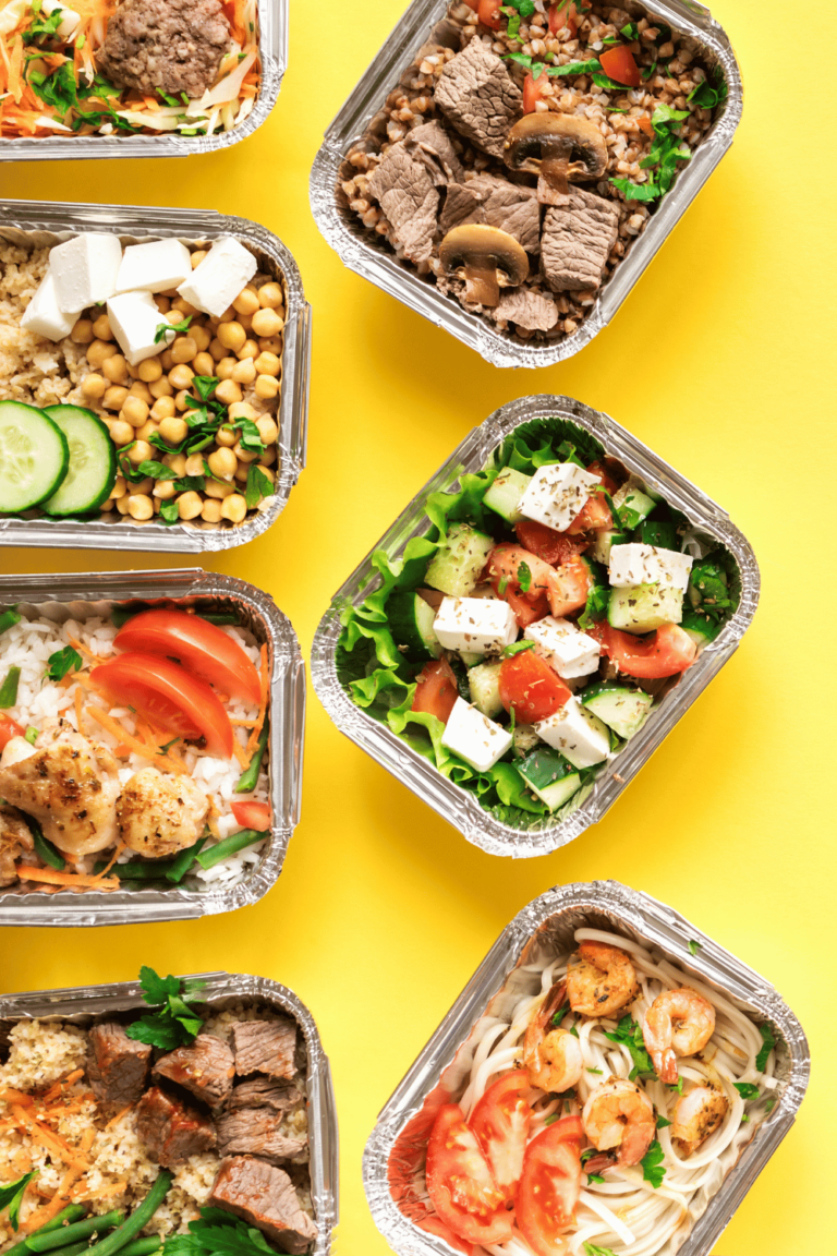 prepared meals in containers with yellow background