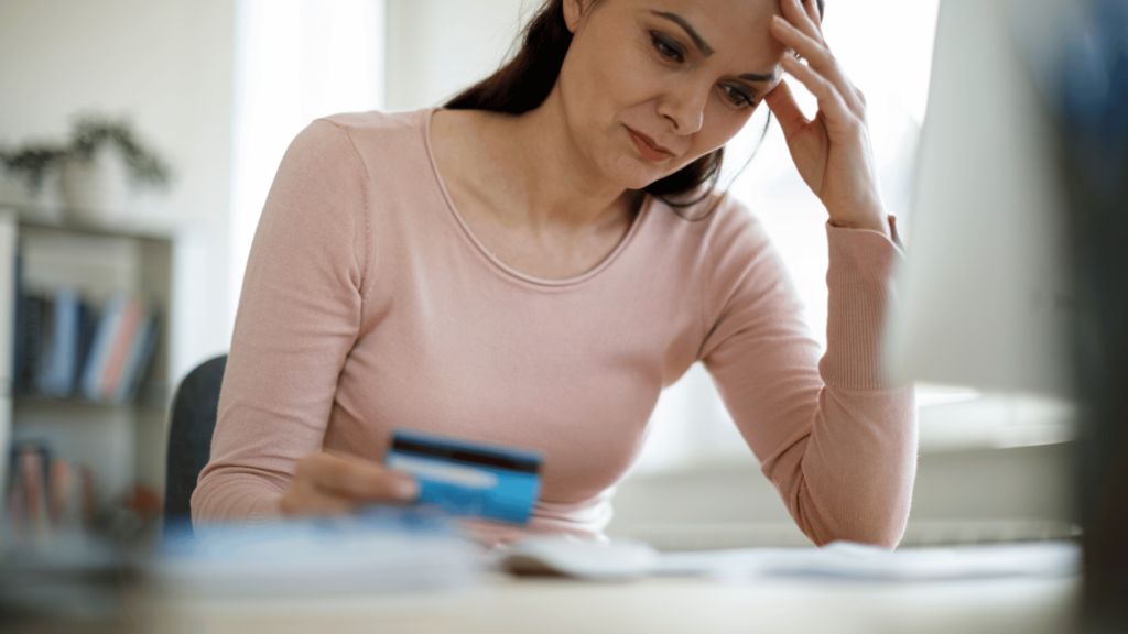 stressed person paying bills