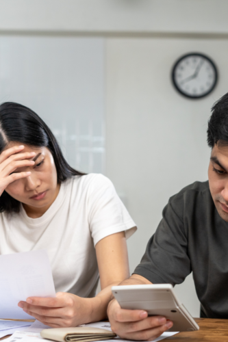 couple stressed looking at finances