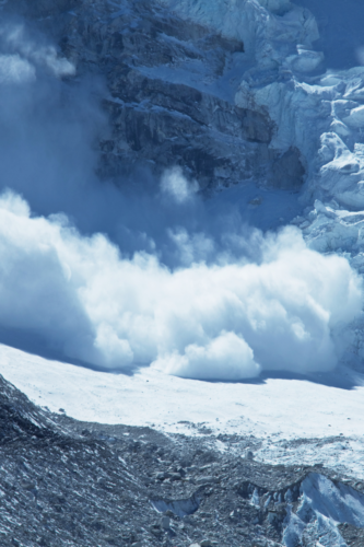 snow avalanche raging down