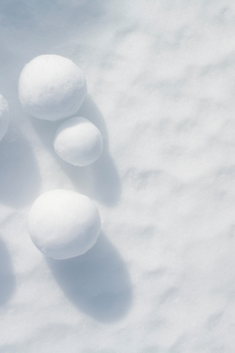 three snowballs in the snow