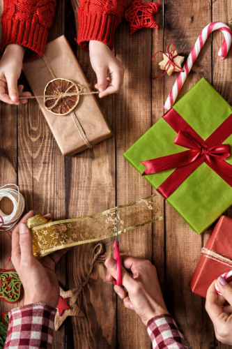 christmas gifts being wrapped and decorated