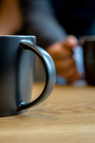 mugs on a wood table top