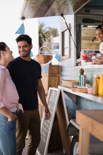 couple about to order food from a food truck